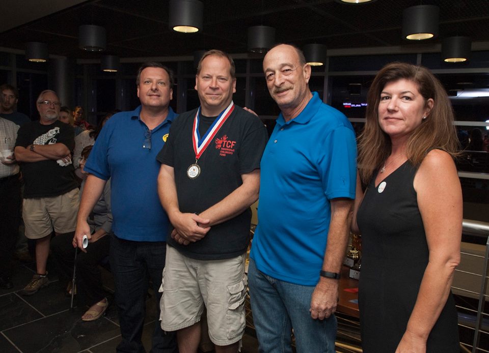 Eddie Mika won 1st Place for his label (Label “L”) with President Frank Mortimer, VP Richard Schluger and Secretary Jaimie Winters.